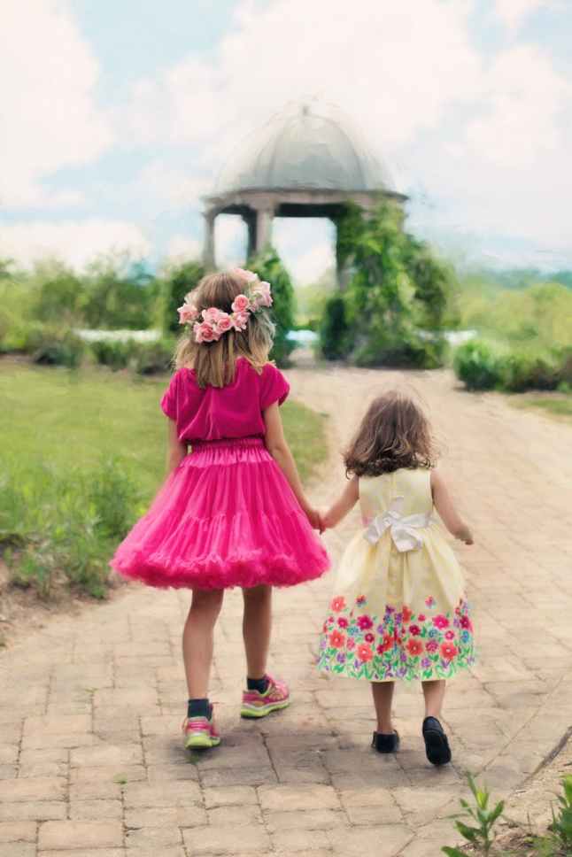 children wearing pink ball dress